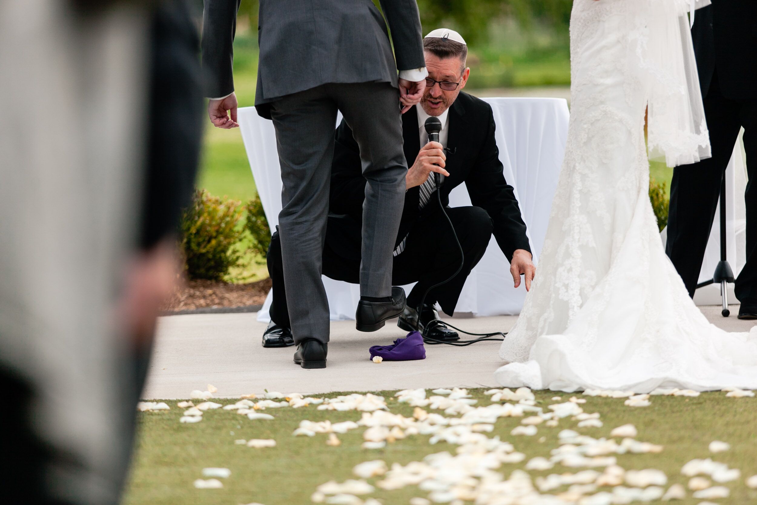 History behind why the couple stomps on a piece of glass in a Jewish wedding