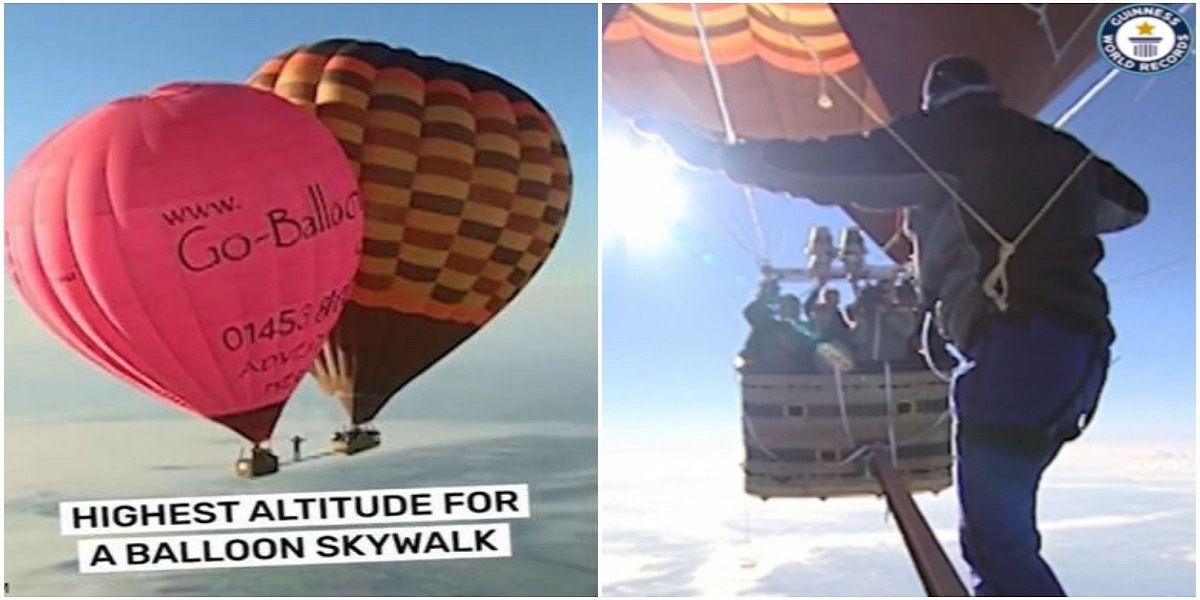Man walking between hot air balloons suspended over 6,500 meters