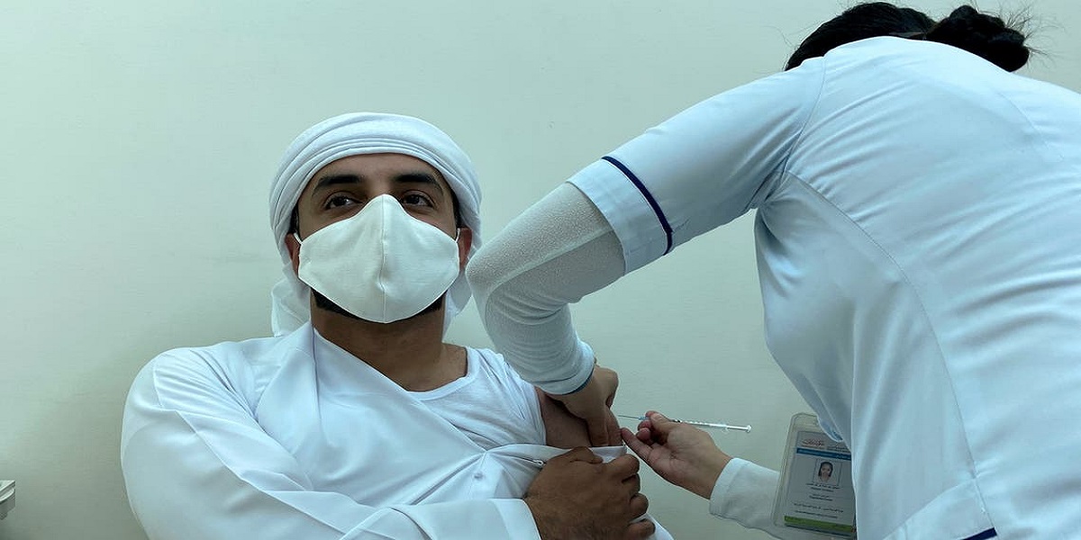 UAE says 100% of population received one Covid jab