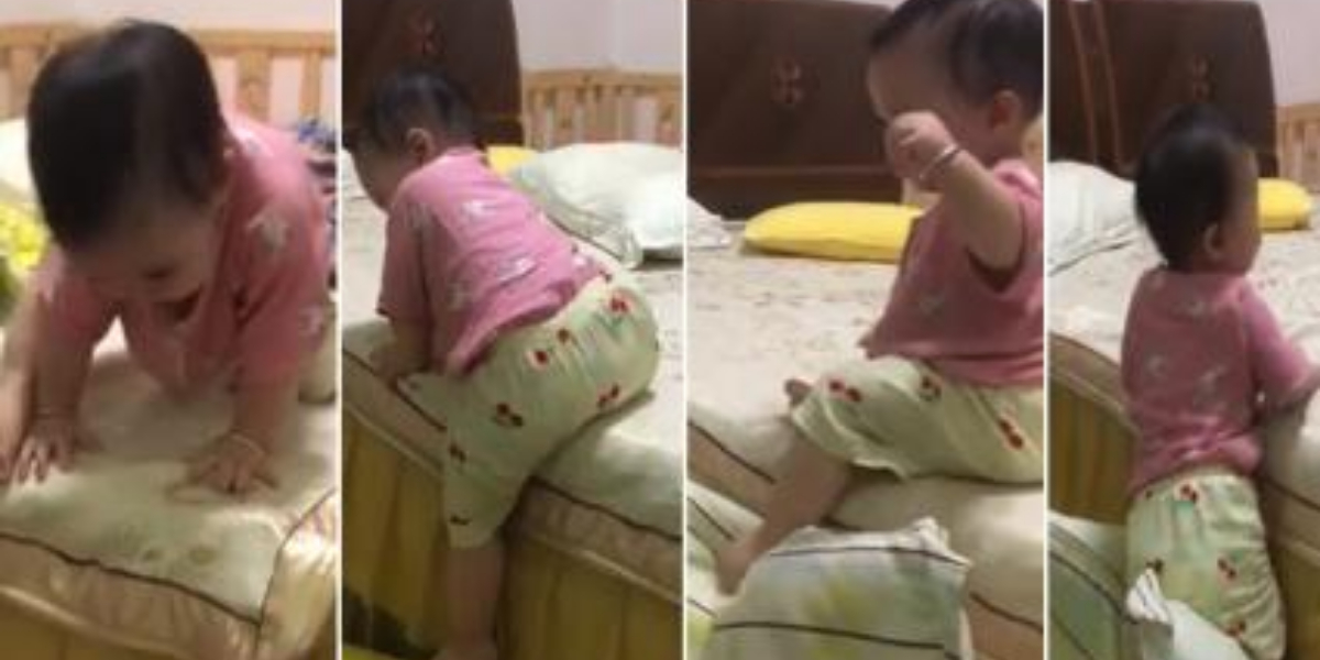 Baby girl gets out of bed using this brilliant technique