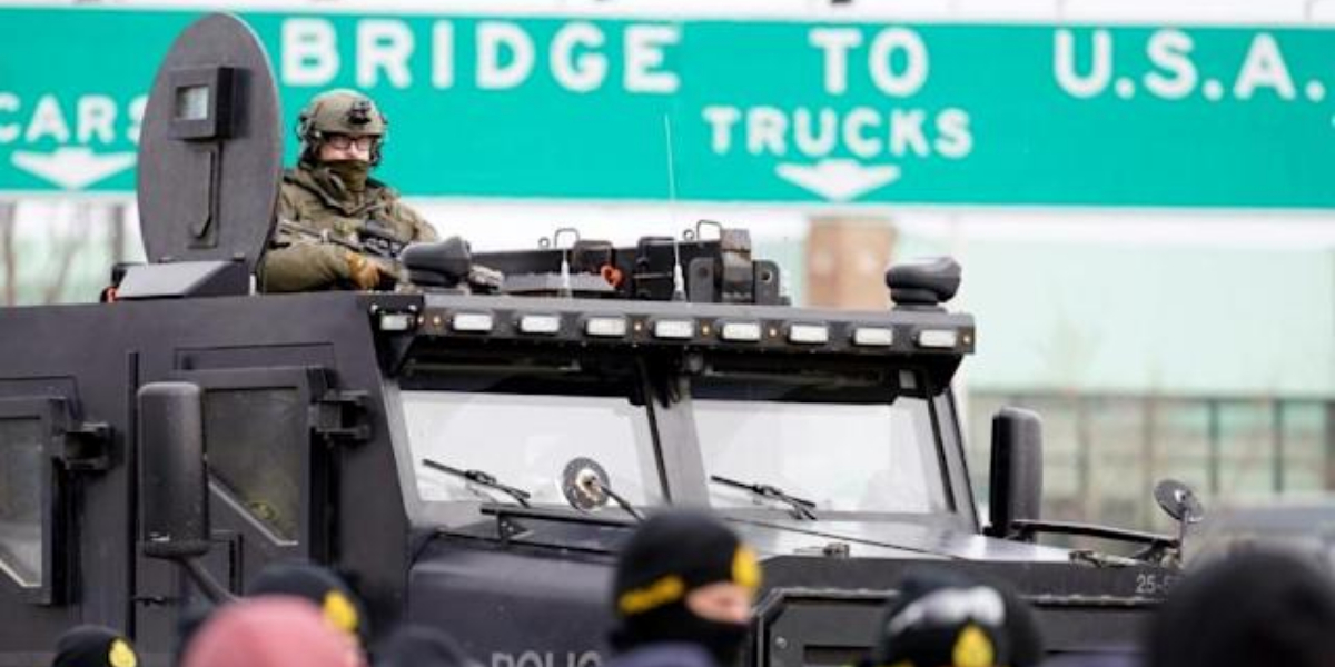 Key US-Canada bridge reopens, truckers still cripple Ottawa