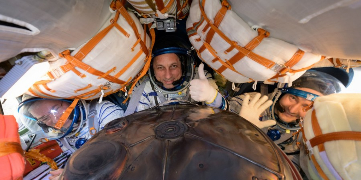 Record-setting NASA astronaut returns from space station with Russian crewmates