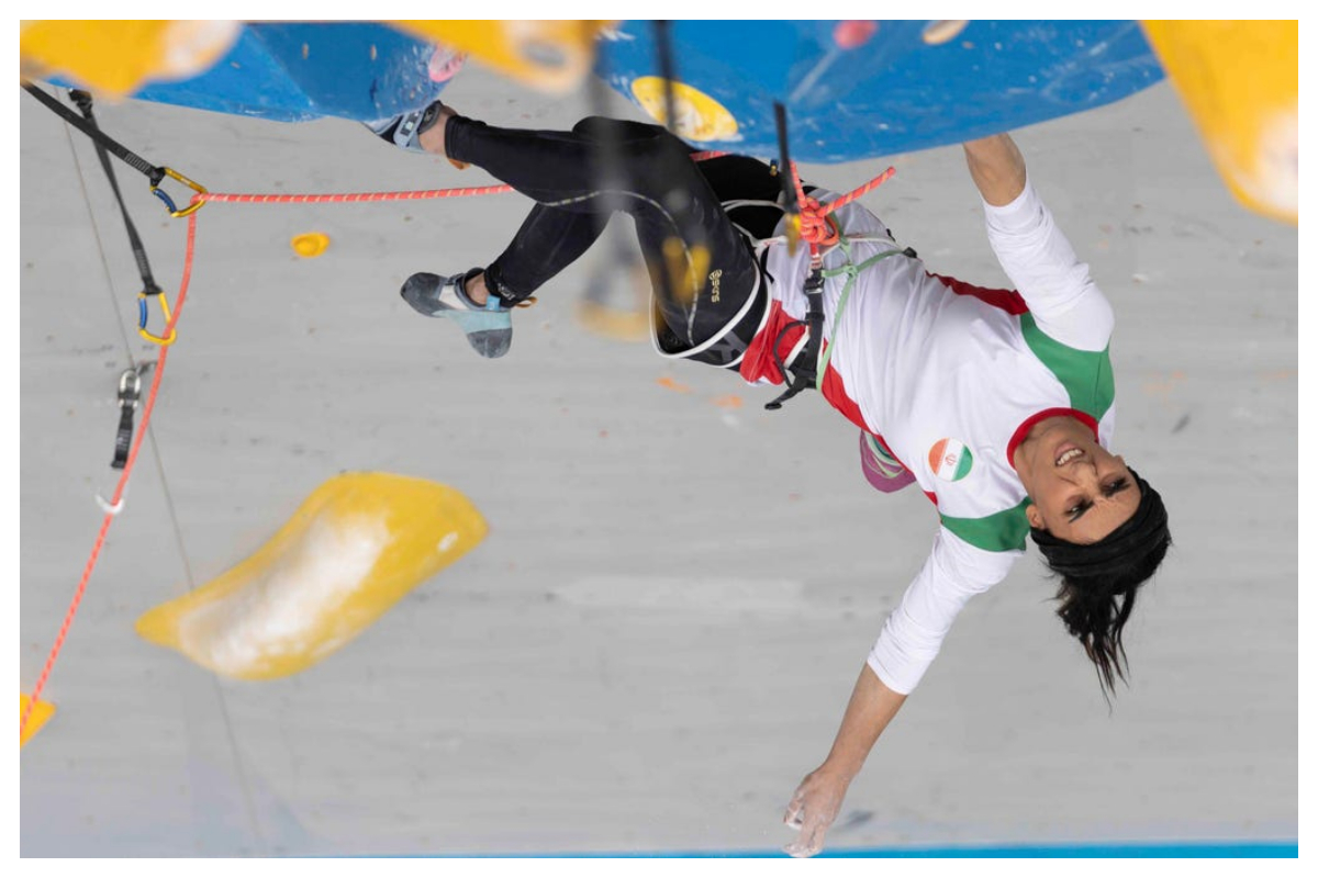 Iranian rock climber returns to Tehran after competing hijab-free