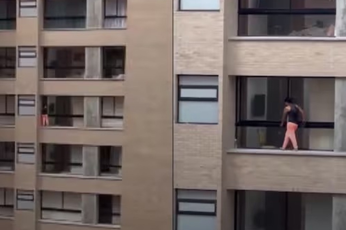 Woman wiping windows