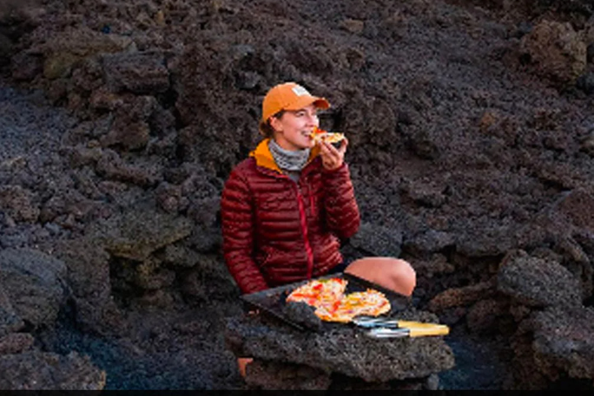 Alexandra eats pizza cooked on an active volcano in Guatemala
