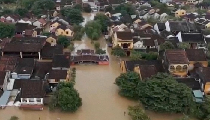Death toll rises to 13 as floods devastate central Vietnam.