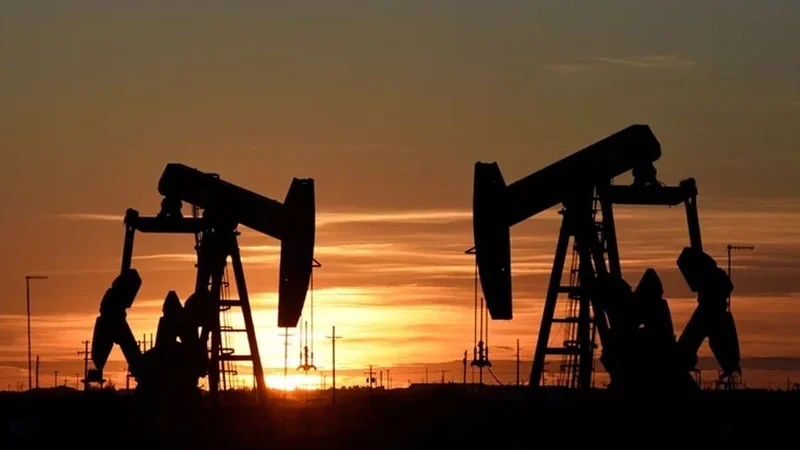 Oil prices slip but stay on track for monthly gain
