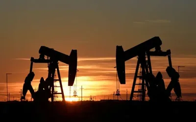 Oil prices slip but stay on track for monthly gain