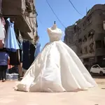 Gaza creative fashion wave turns waste materials into stylish girls dresses