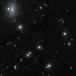 Astronomers spot nearly invisible galaxy packed with dark matter