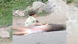 Kashmir Bleeds: Photo of a child sitting on grandfather’s dead body shakes the world