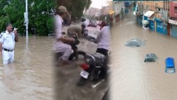Roads and streets turn into ponds after heavy rains lash Karachi