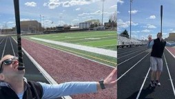 Man walks 2.2 miles while holding a baseball bat on chin