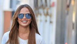 Chrissy Teigen exudes style in slashed jeans