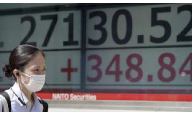 Tokyo shares end up after surges on Wall Street