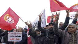 Tunisia halts as unions challenge president