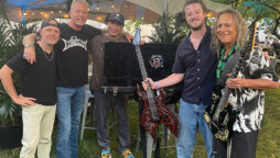 Joseph Quinn performs with Metallica at Lollapalooza