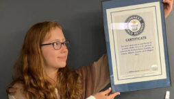 A teenager sets Guinness World Record for number of socks worn in 30 seconds