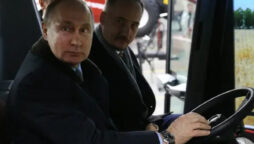 Vladimir Putin receives a tractor,