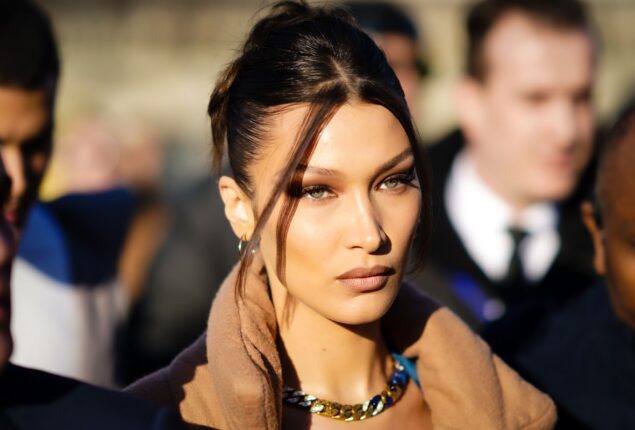 Bella Hadid closed the show during Paris Fashion Week in an iconic spray-on dress