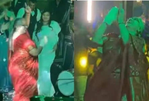 Party-stealing elderly woman dances energetically. Watch