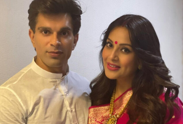 Bipasha Basu poses with Karan Singh Grover, showing her baby bump