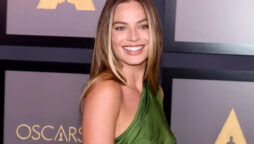 Margot Robbie discusses how she improvised a scene with Brad Pitt for Babylon