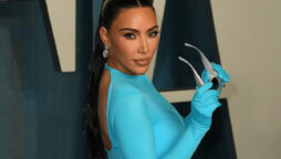 Kim Kardashian dazzles in a silver sequin outfit for christmas eve