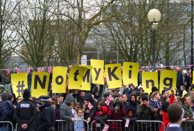 King Charles spotted ‘waving’ at Milton Keynes protesters