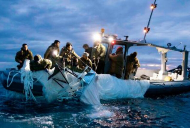 FBI publishes images of officers handling spy balloon