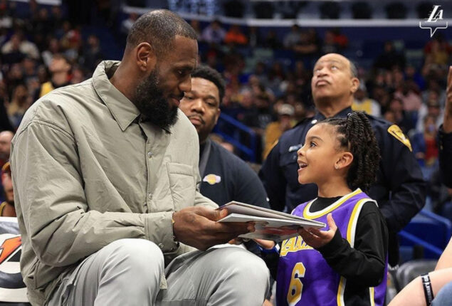 LeBron James signs his children’s book ‘I Promise’ for girl