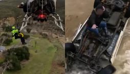 Woman Survives 15 Hours on Overturned Car in Flood