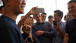 Apple CEO Tim Cook vows to boost Chinese investment amid trade tensions