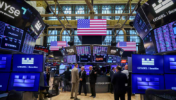 U.S. stock market hits record highs amid strong earnings and eased bank fears.
